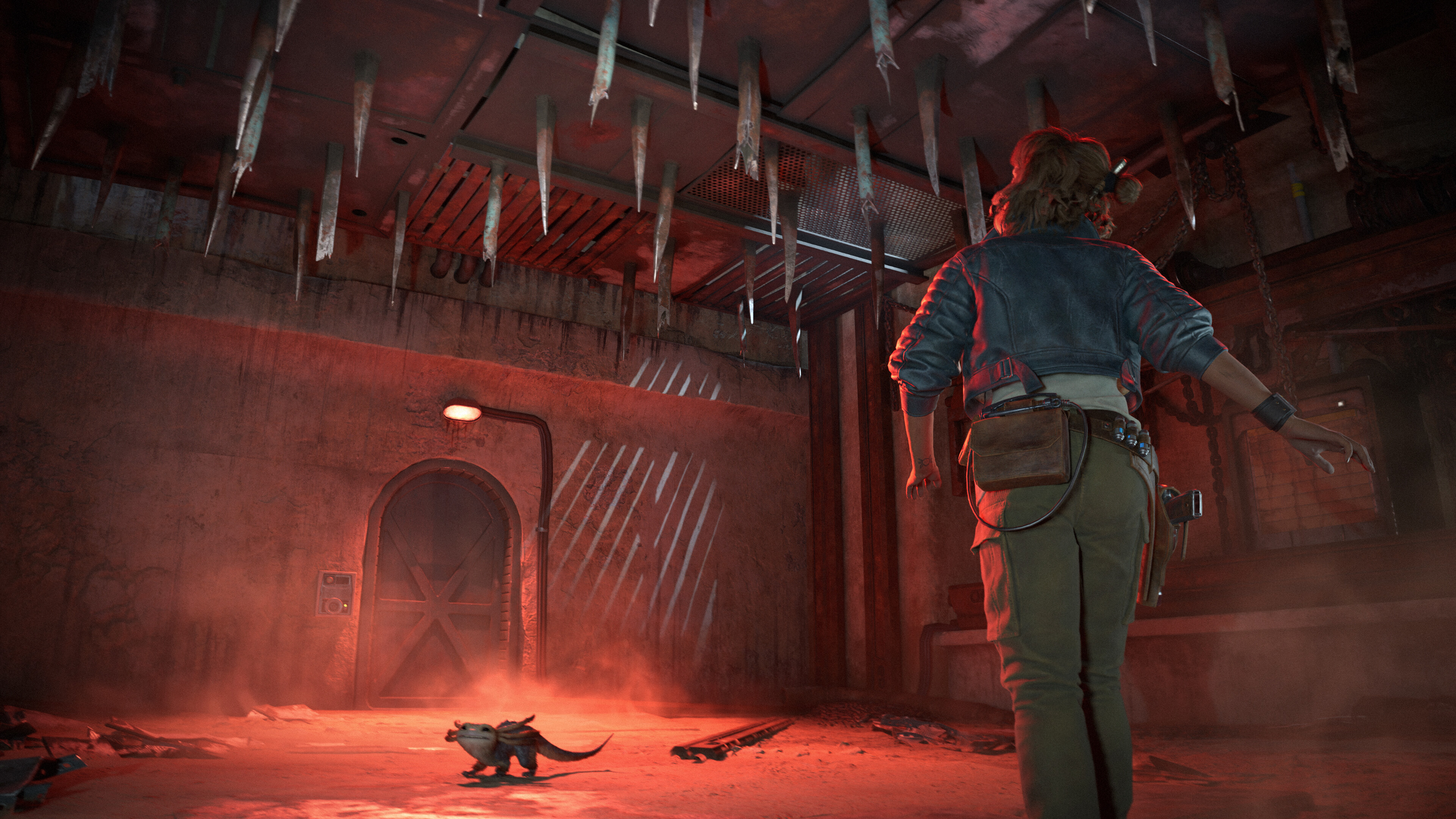 Kay Vess walking under a ceiling spike trap in Star Wars Outlaws.