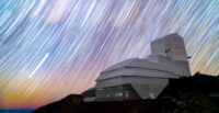 Rubin Observatory beneath colorful star trails