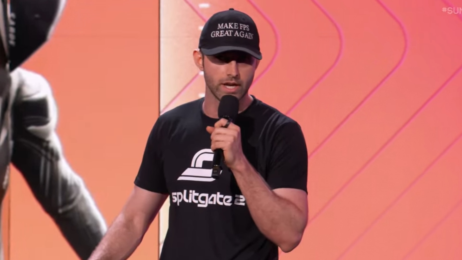 Ian Proulx takes the stage at Summer Game Fest with a hat reading 