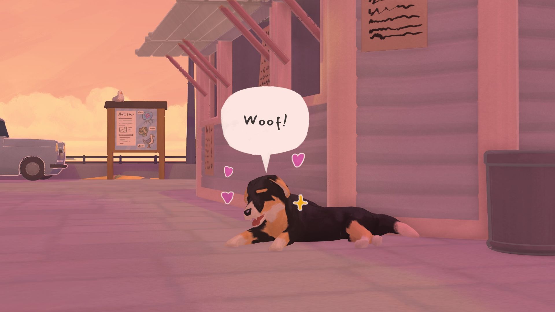 A brown, white, and black dog laying on the ground outside in Tiny Bookshop. He's got a speech bubble with "Woof!" over his head and is surrounded by hearts and stars to indicate he's happy. 
