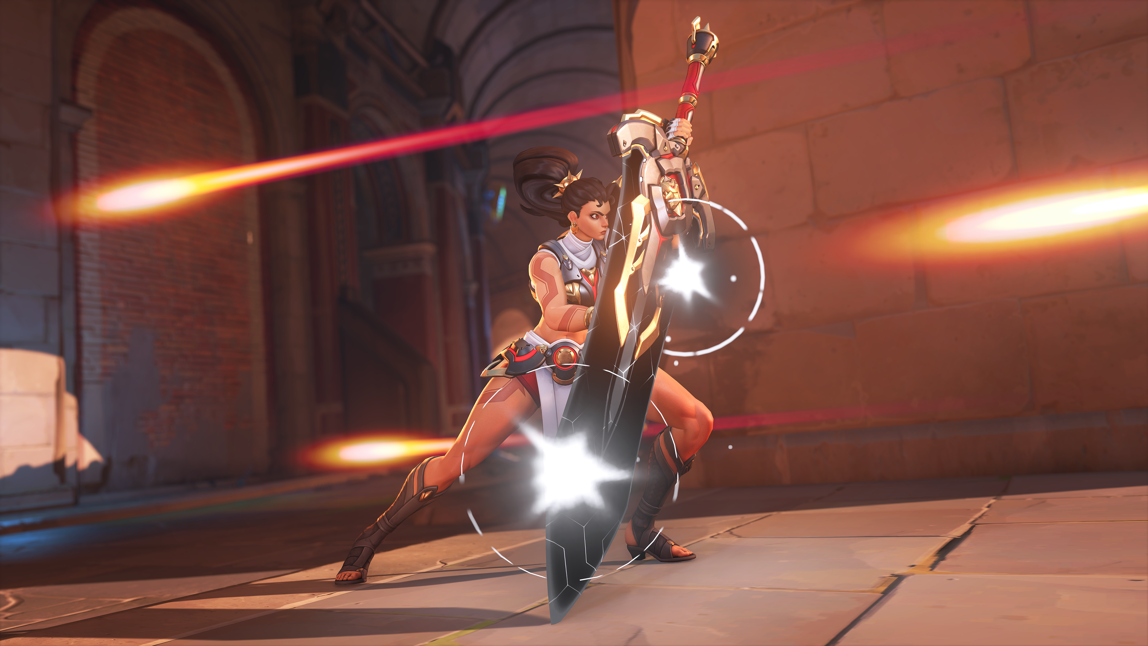 A promotional screenshot of Overwatch 2's new hero Vendetta. A tall muscular woman holds a sword with a black blade in front of her to block incoming fire.