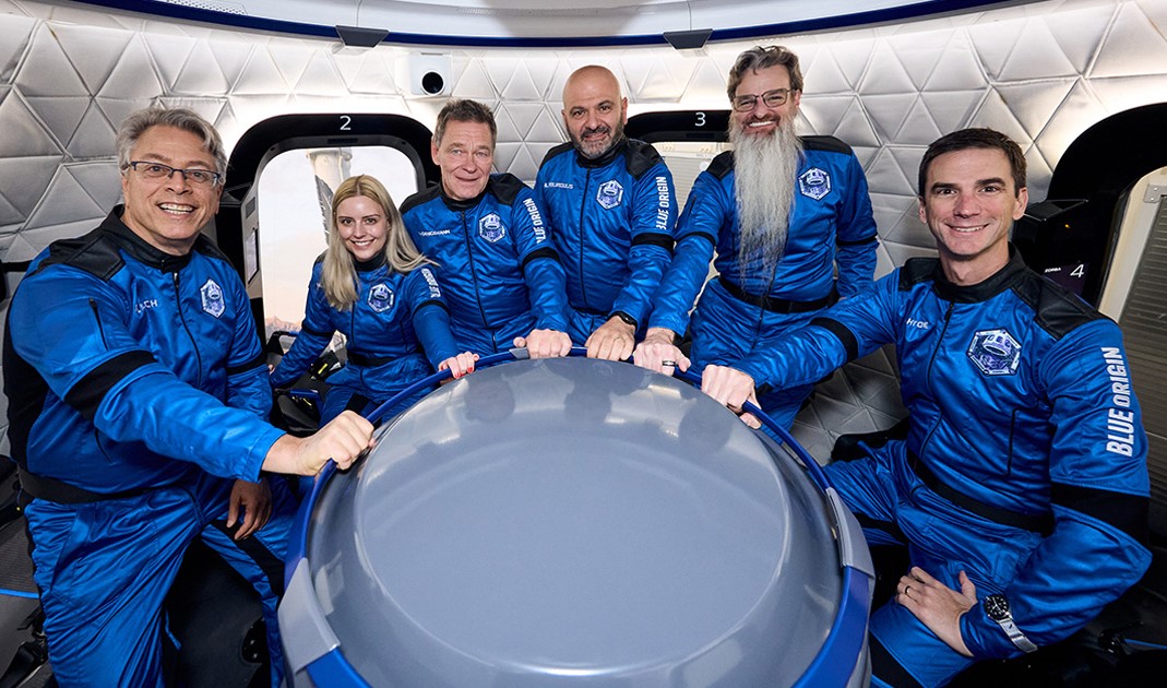 Crew of NS-37 sits in Blue Origin New Shepard capsule mockup during training
