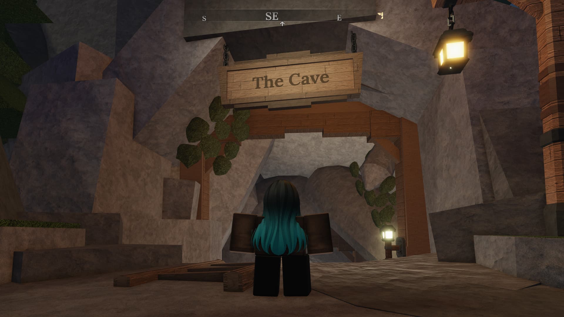 The Cave entrance in The Forge, it's marked with a big sign out front and the compass displays "SE" for southeast.