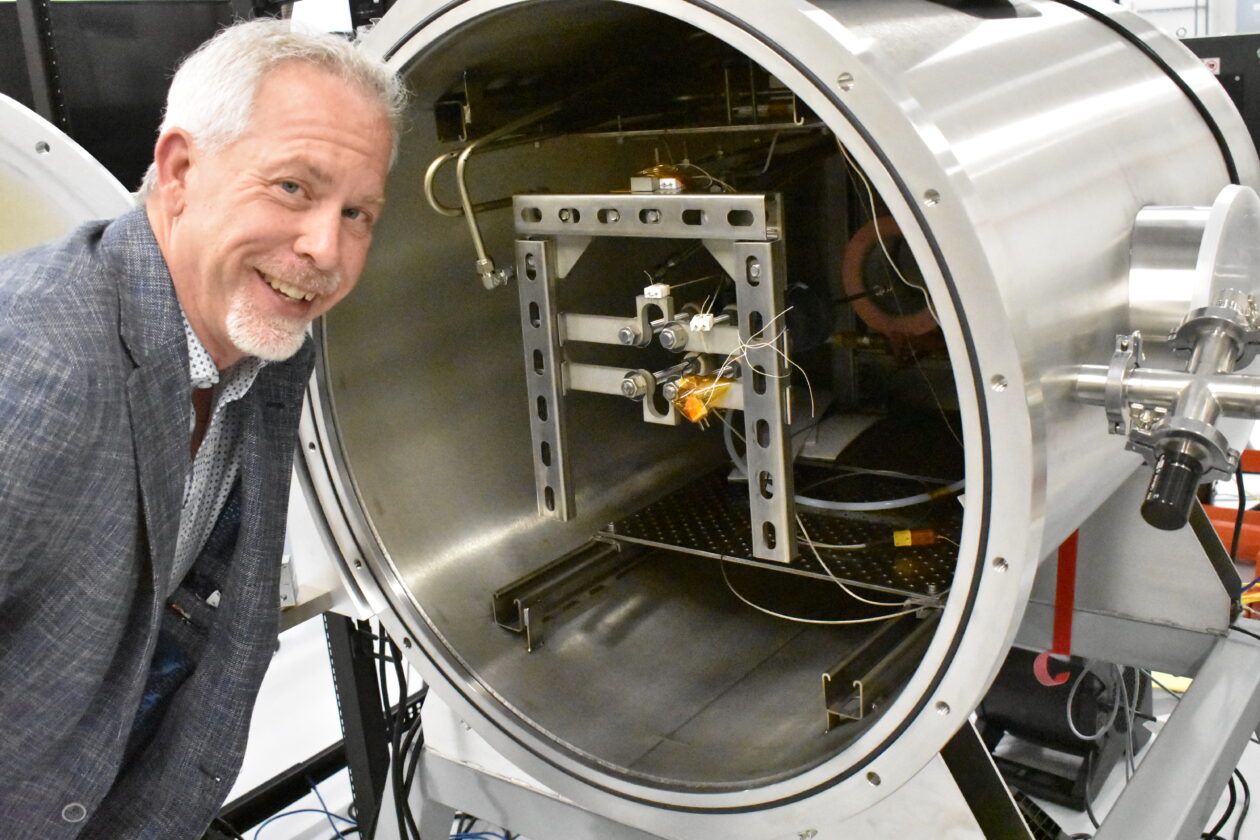 Jeff Thornburg at Portal Space Systems with vacuum chamber