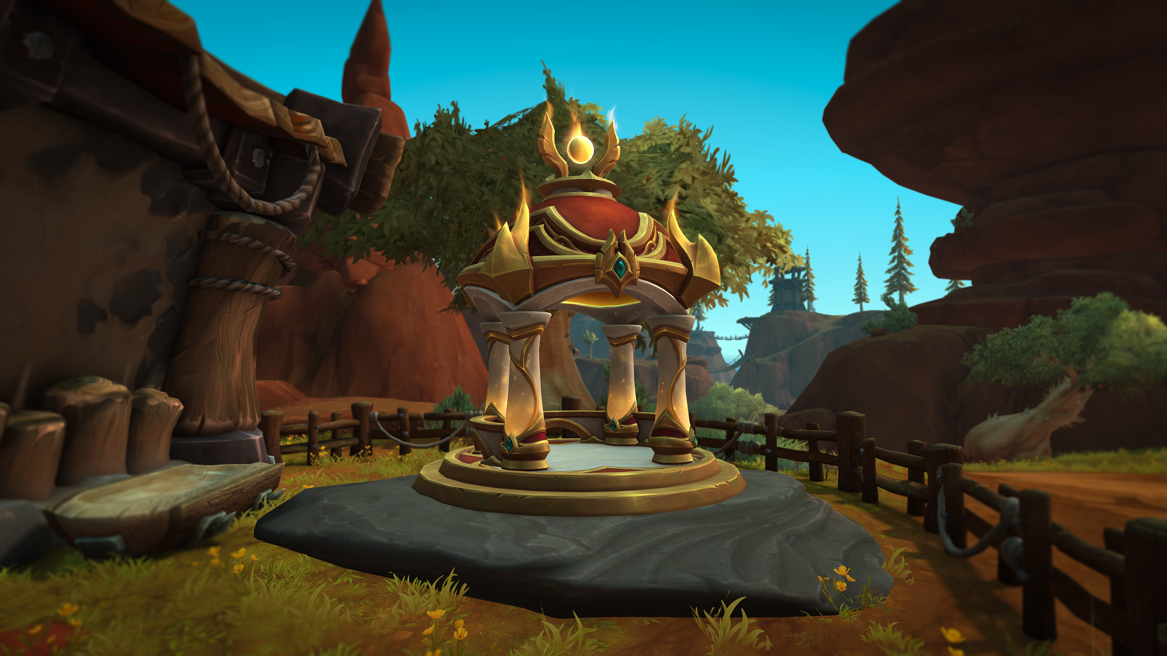 A screenshot of a World of Warcraft's player housing. An elven gazebo sits on top of a rock, its gold accents gleaming in the daylight.