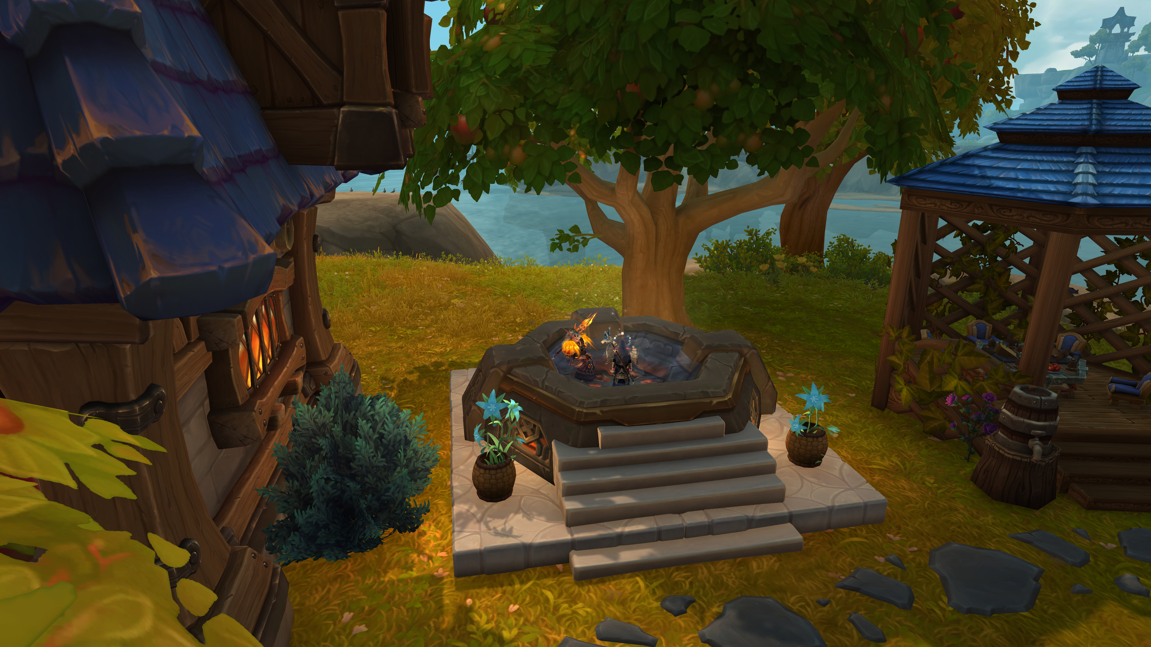 A screenshot of a World of Warcraft's player housing. A custom-made hot tub sits between two buildings.