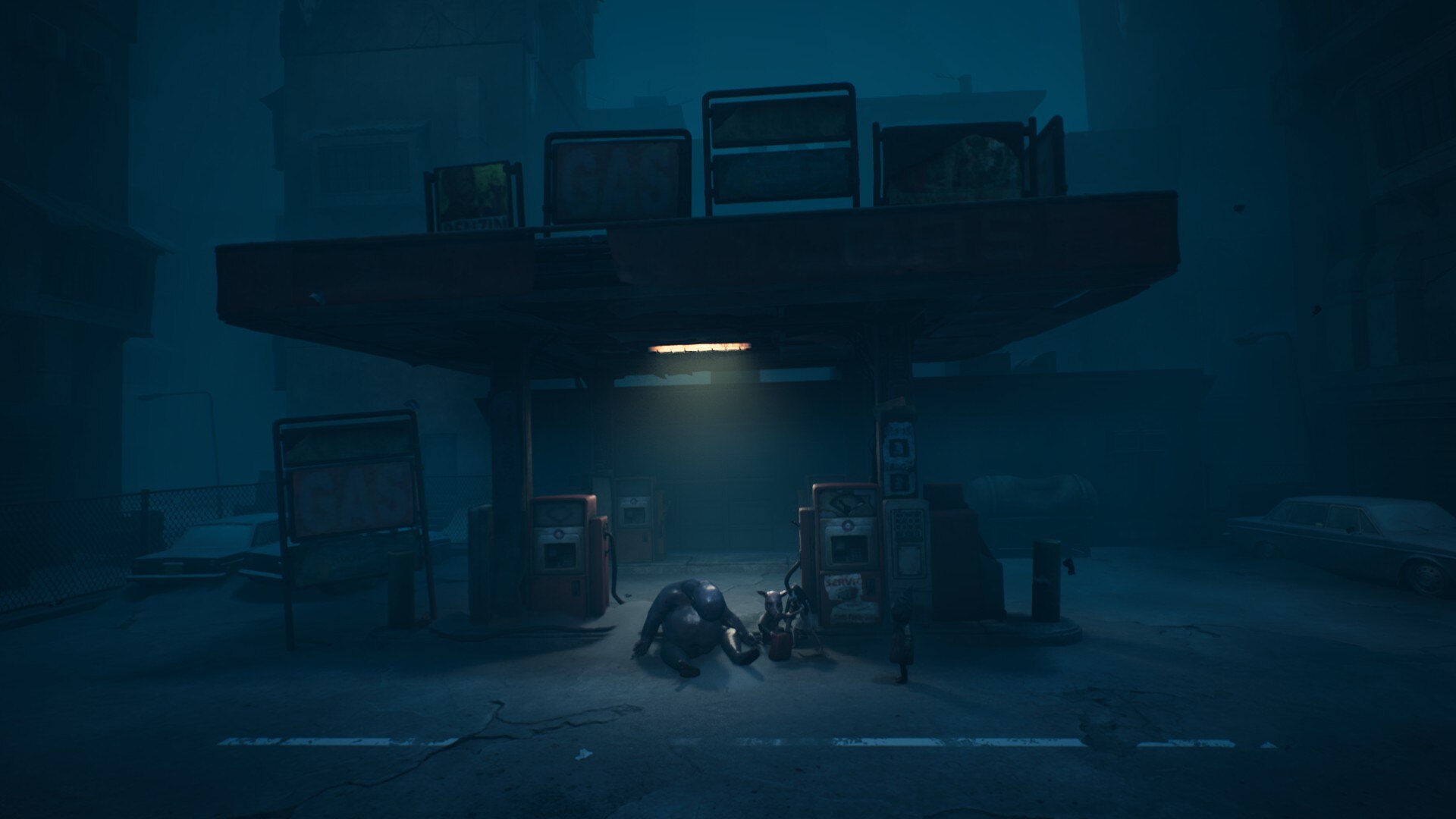 A ruined petrol station by night