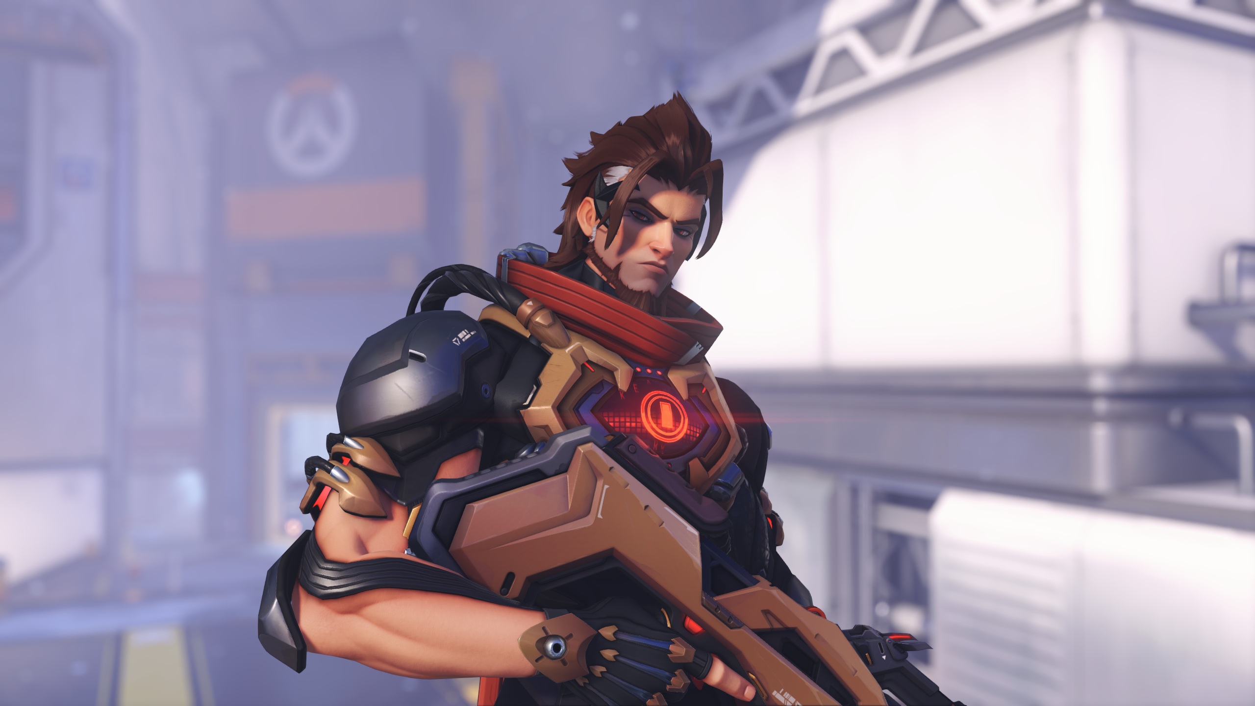 An in-game screenshot of an Overwatch hero. A man with cybernetic implants and a glowing red chest is holding a rifle.