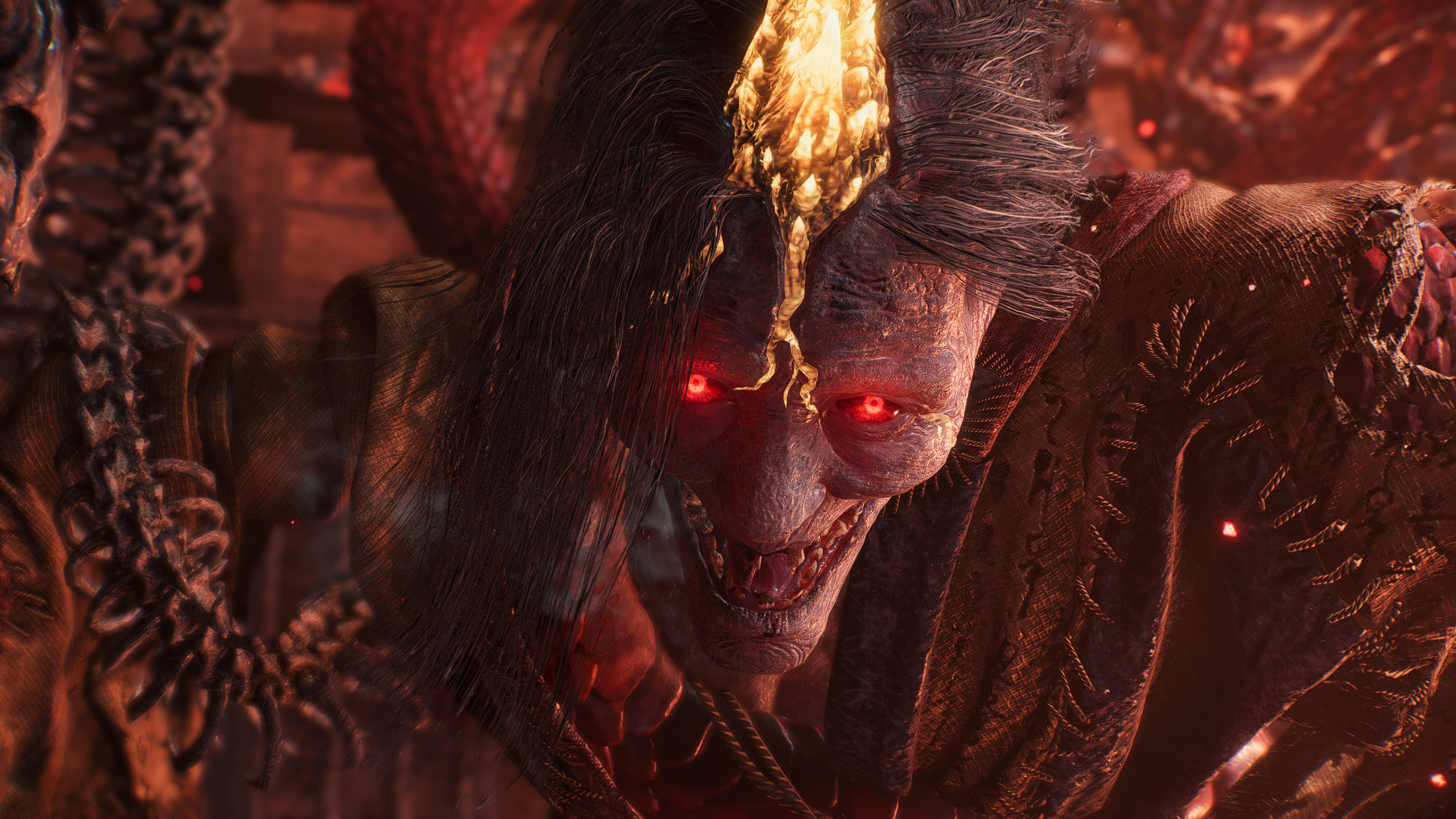 Nioh 3 Jakotsu-baba: A close-up of Jakotsu-baba's menacing grin, with glowing red eyes.