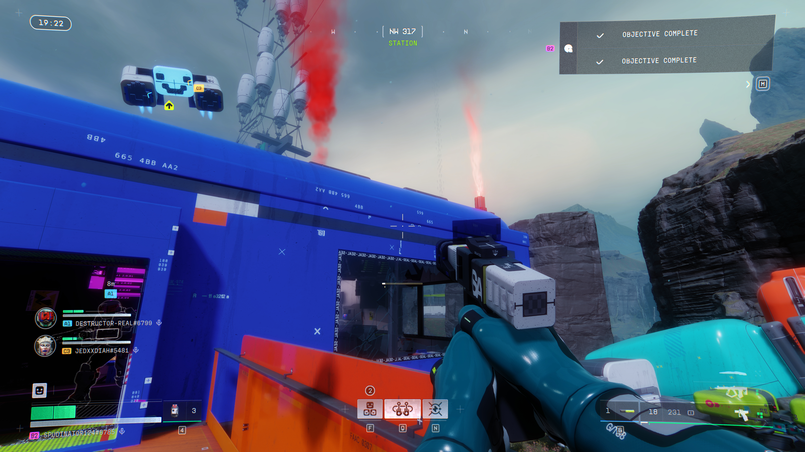 Marathon Lockbox Key: A player looking at a blue building with red flares on the roof. 