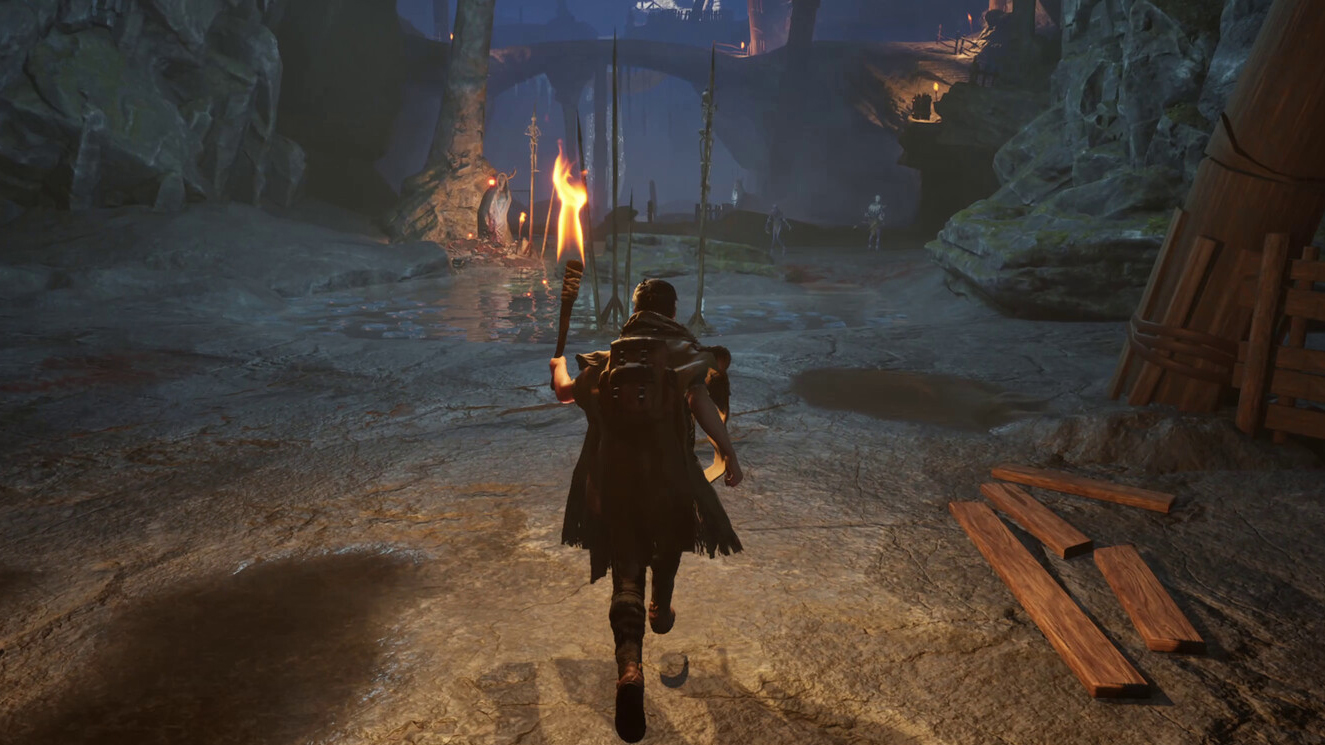 Adventurer in a cave holding a torch