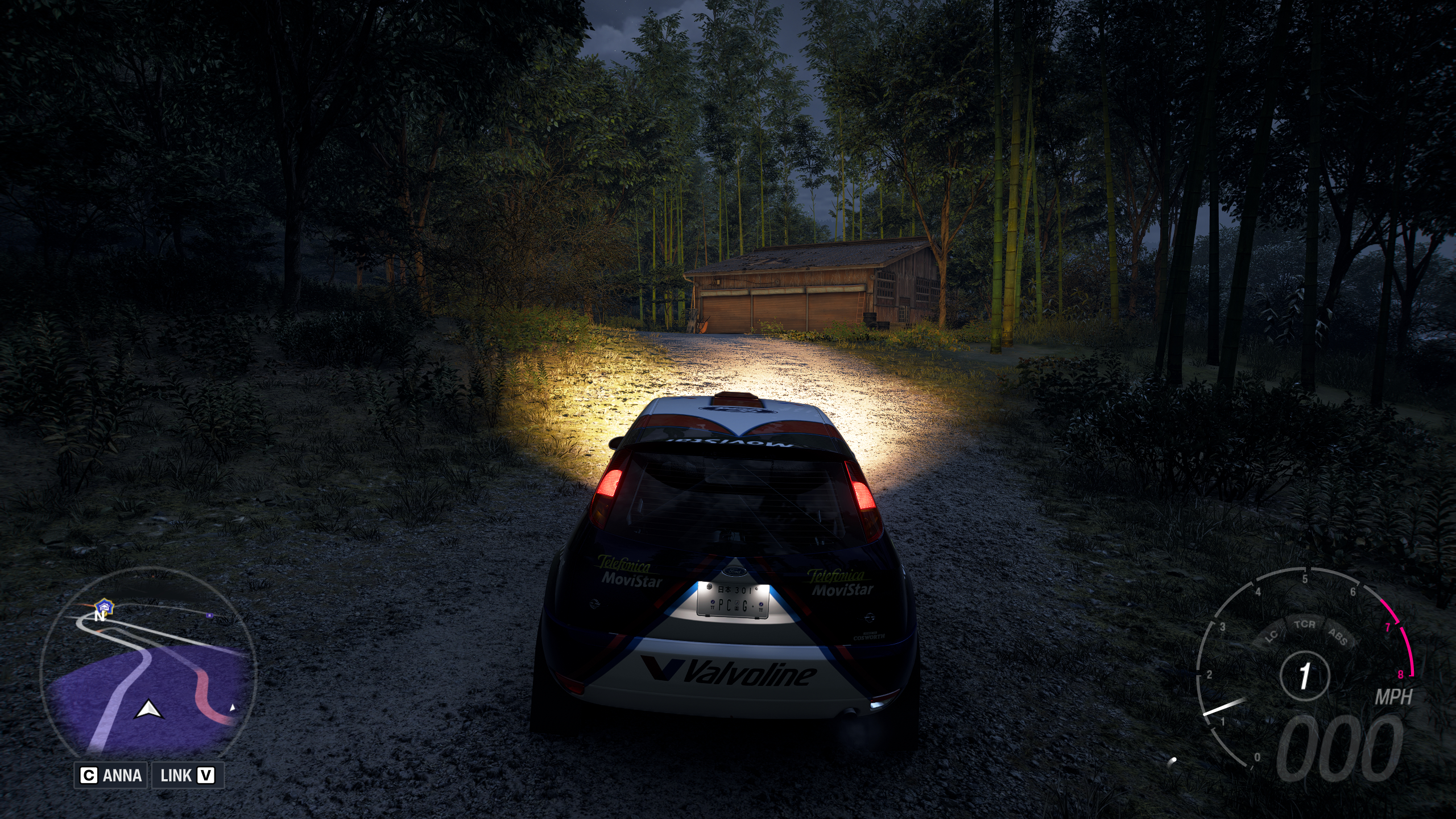 Forza Horizon 6 Barn Finds: A player parked outside an old wooden barn on a wooded hillside at night.