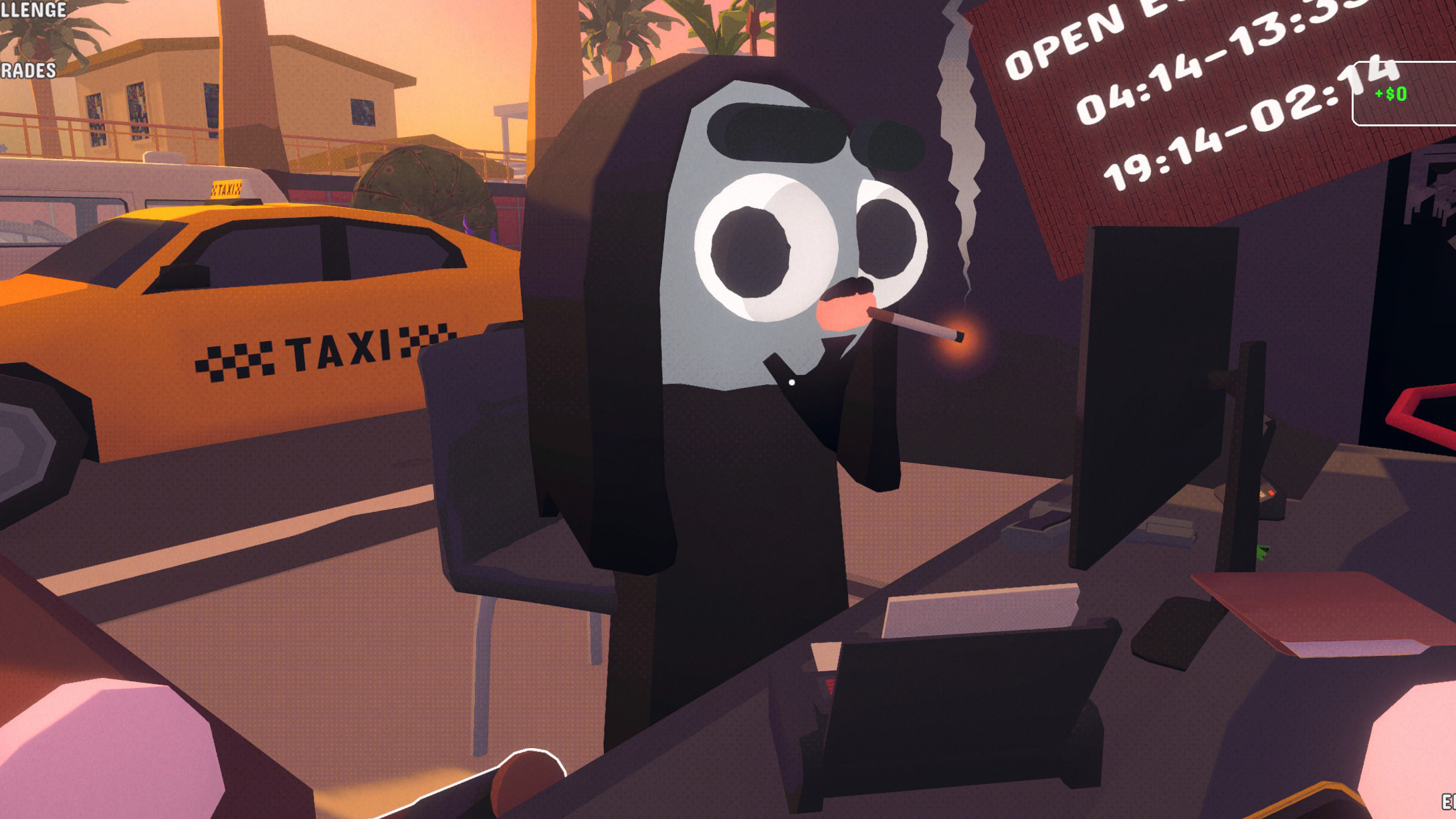 A guy at a computer smoking a cigarette