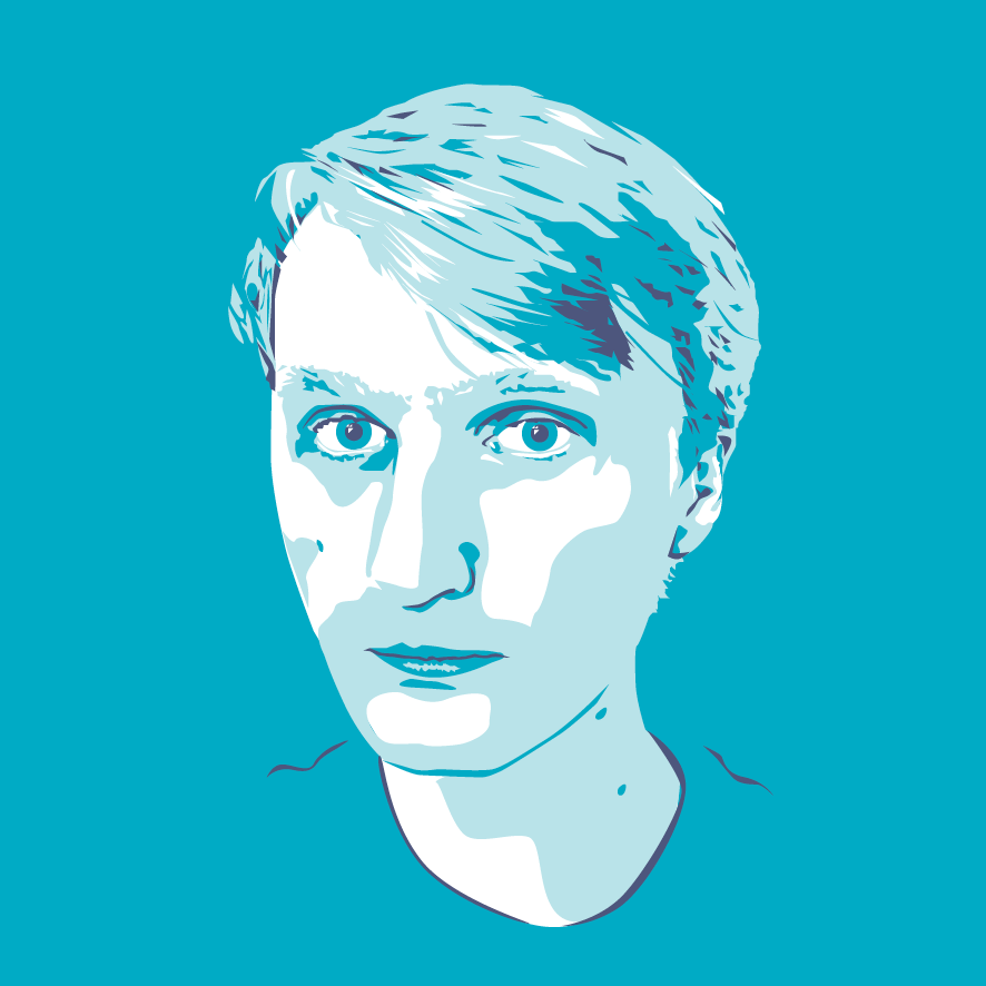 Headshot of Joshua Wolens in teal.