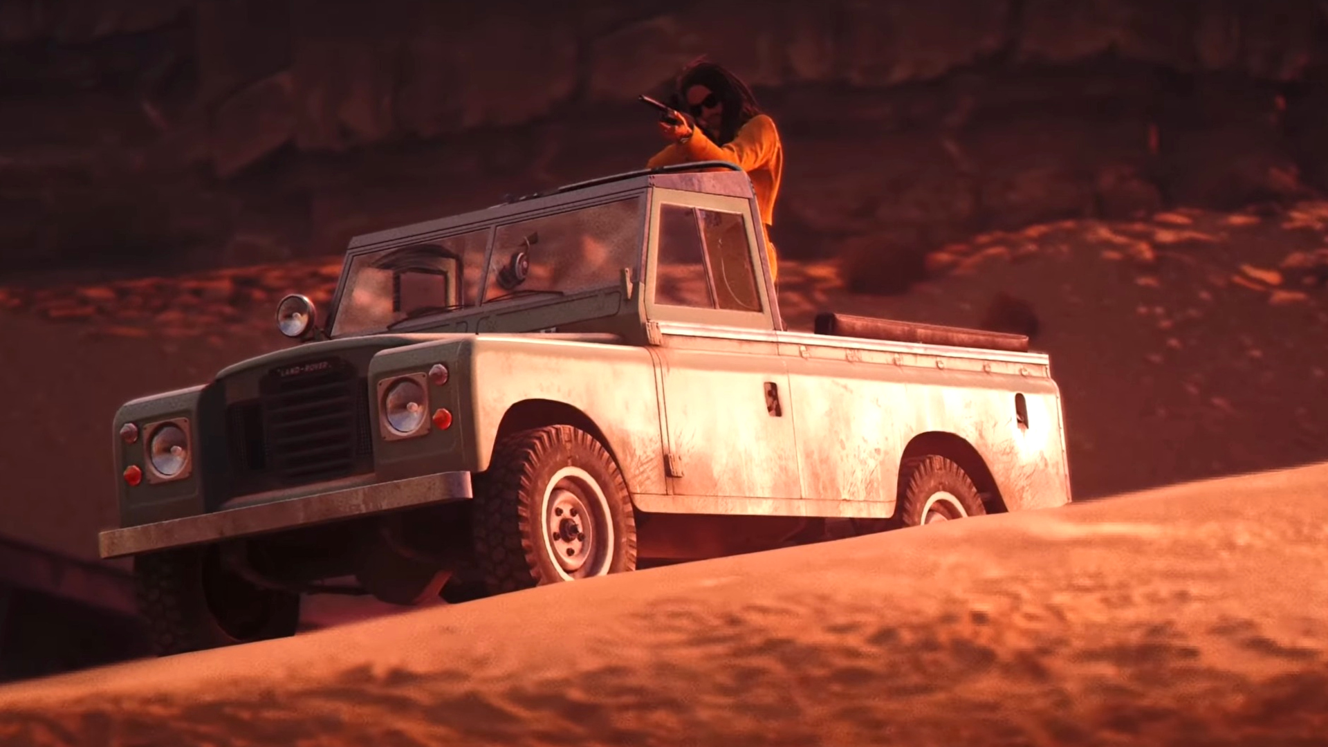 Lenny Kravitz in a Land Rover.