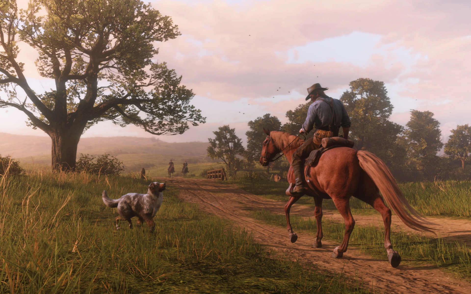 Red Dead Redemption 2 - Arthur Morgan rides a horse on a dirt road in a grassy prairie.