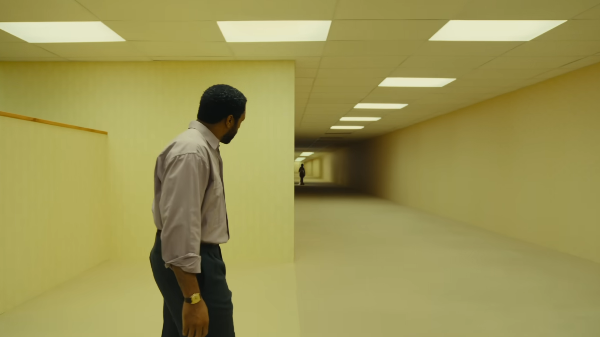 Clark looking down a hallway.