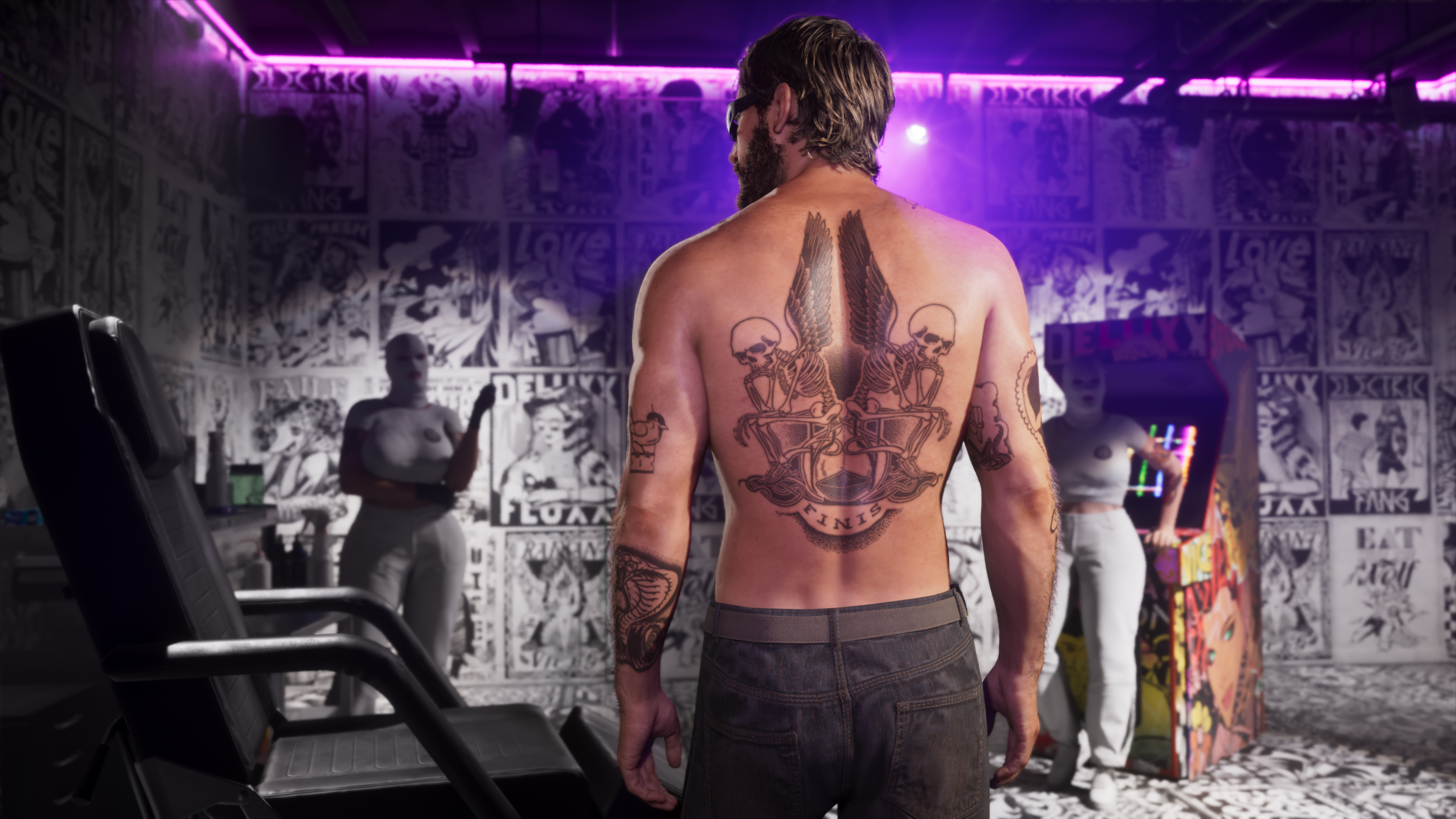 Jason shows off a back tattoo.