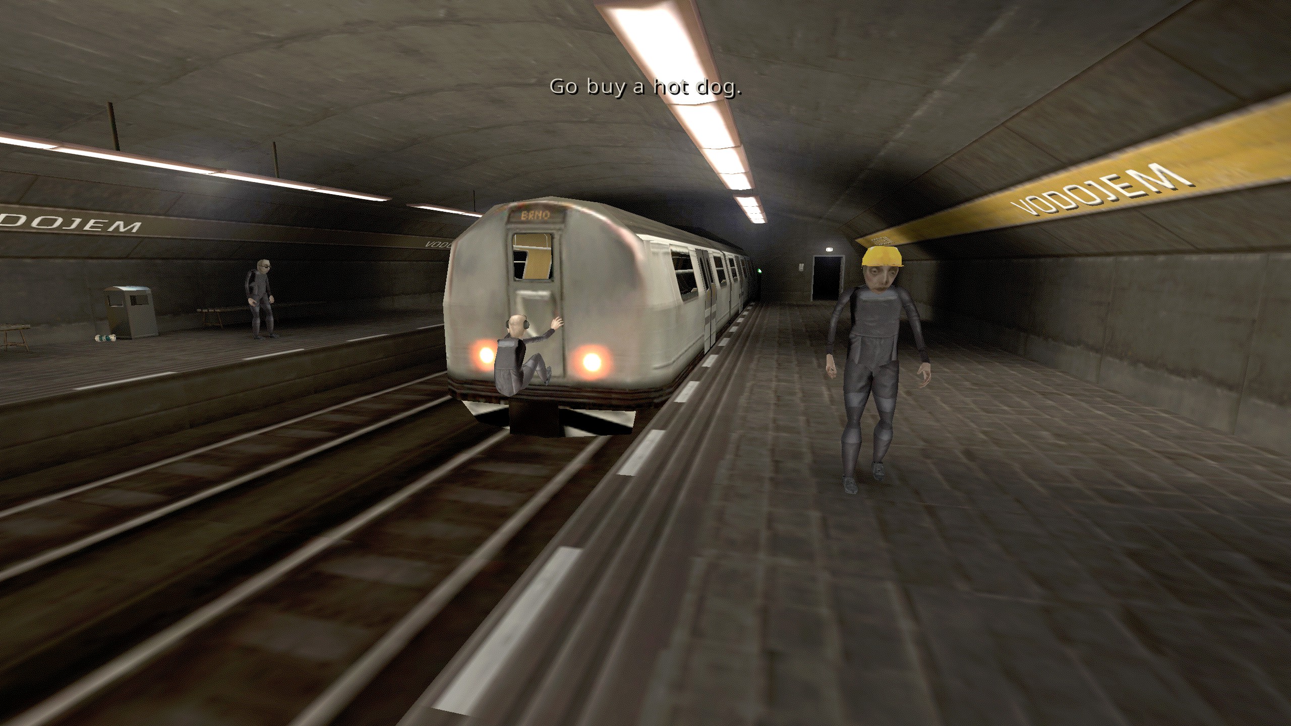 Brno Transit man hanging off end of train