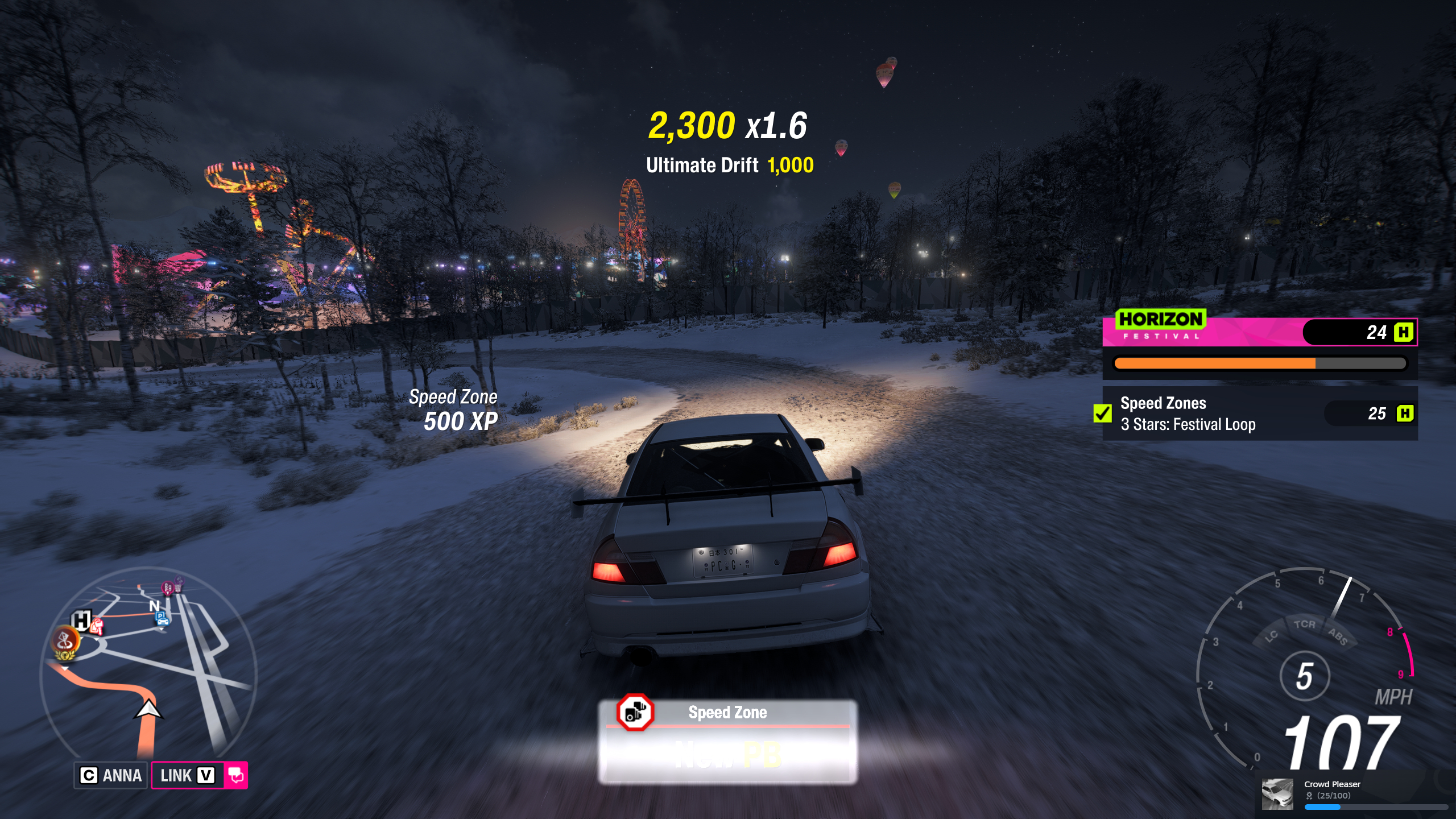 Forza Horizon 6 Festival Loop: A Mitsubishi Lancer Evolution driving down the speed zone at night.