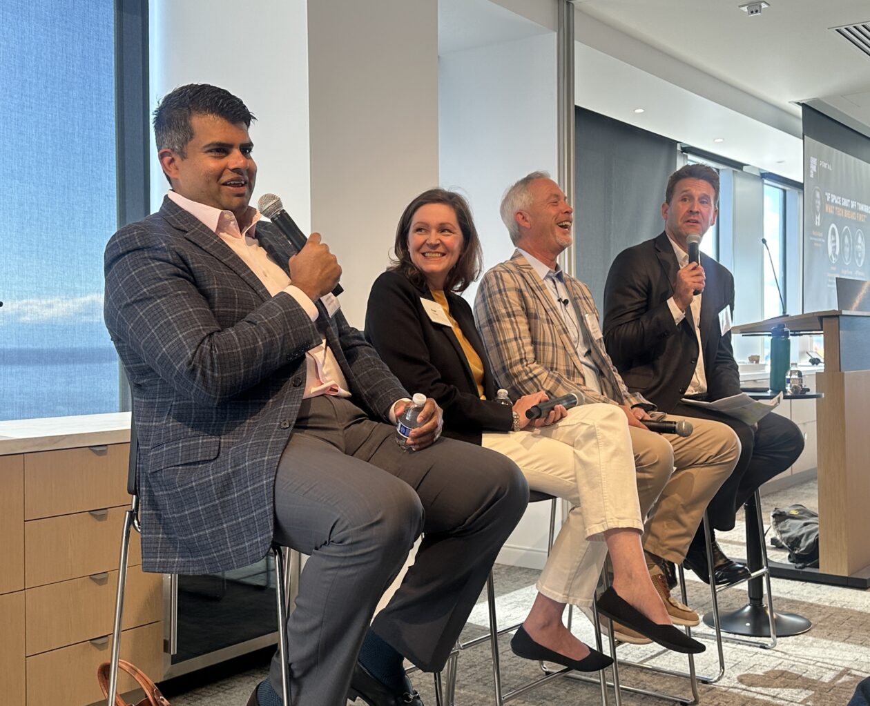 Seattle Tech Week panelists laughing at a wry comment