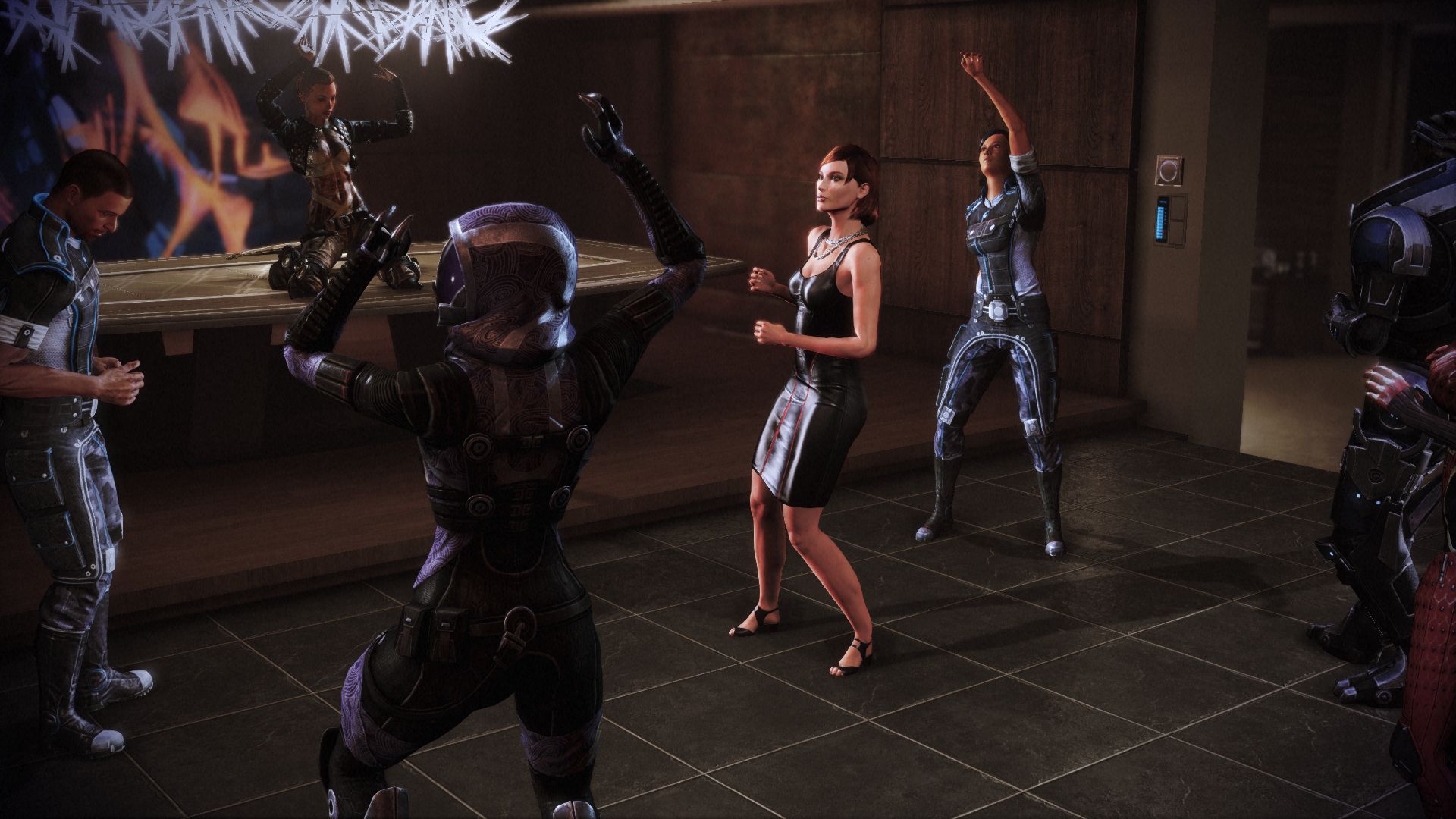Shepard dances with Tali, Jack, and the rest of the Normandy's crew