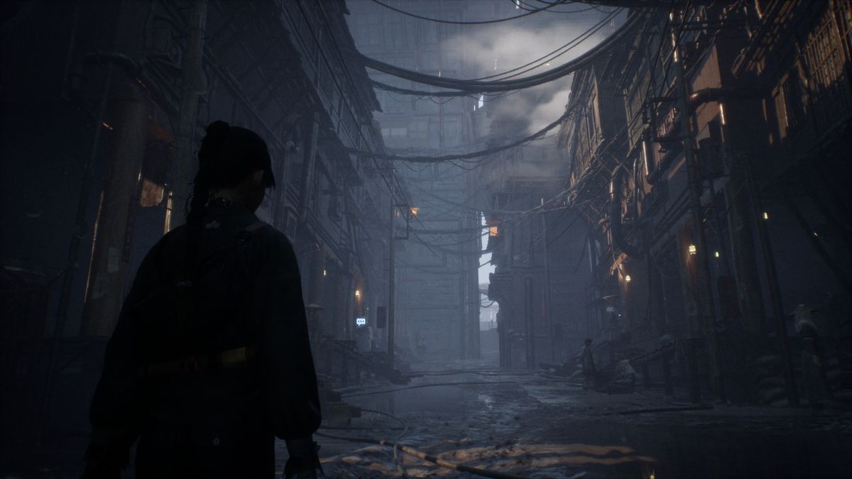 A woman stands in a ruined urban environment