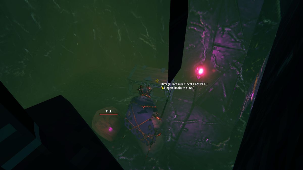 Valheim - A player interacting with a treasure chest in a Mistlands dungeon.